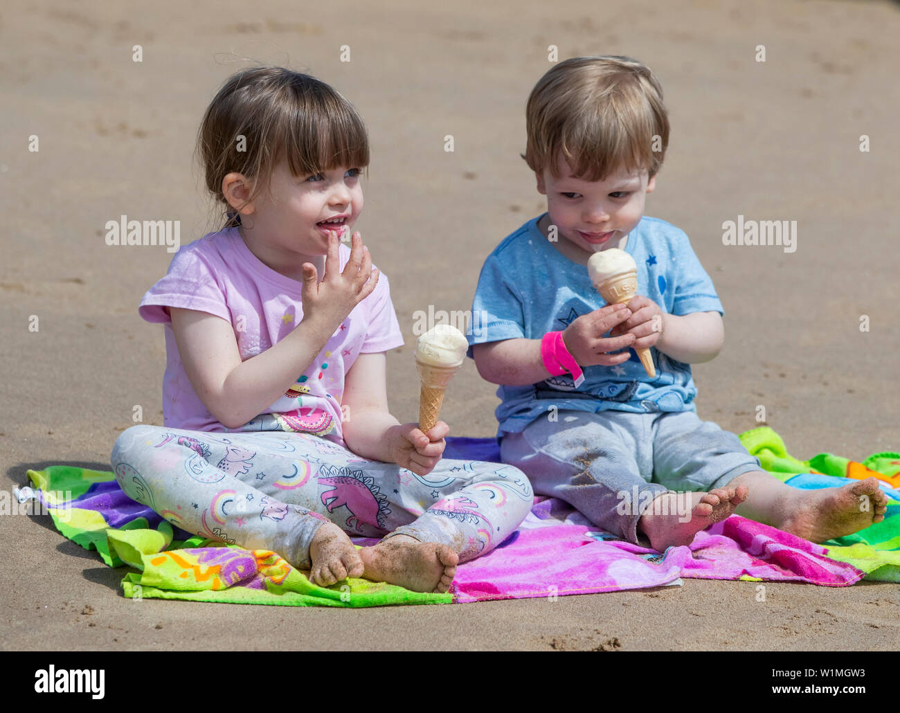 Hollie Mullen and Harry Mullen enjoy ice creams on Bridlington beach as