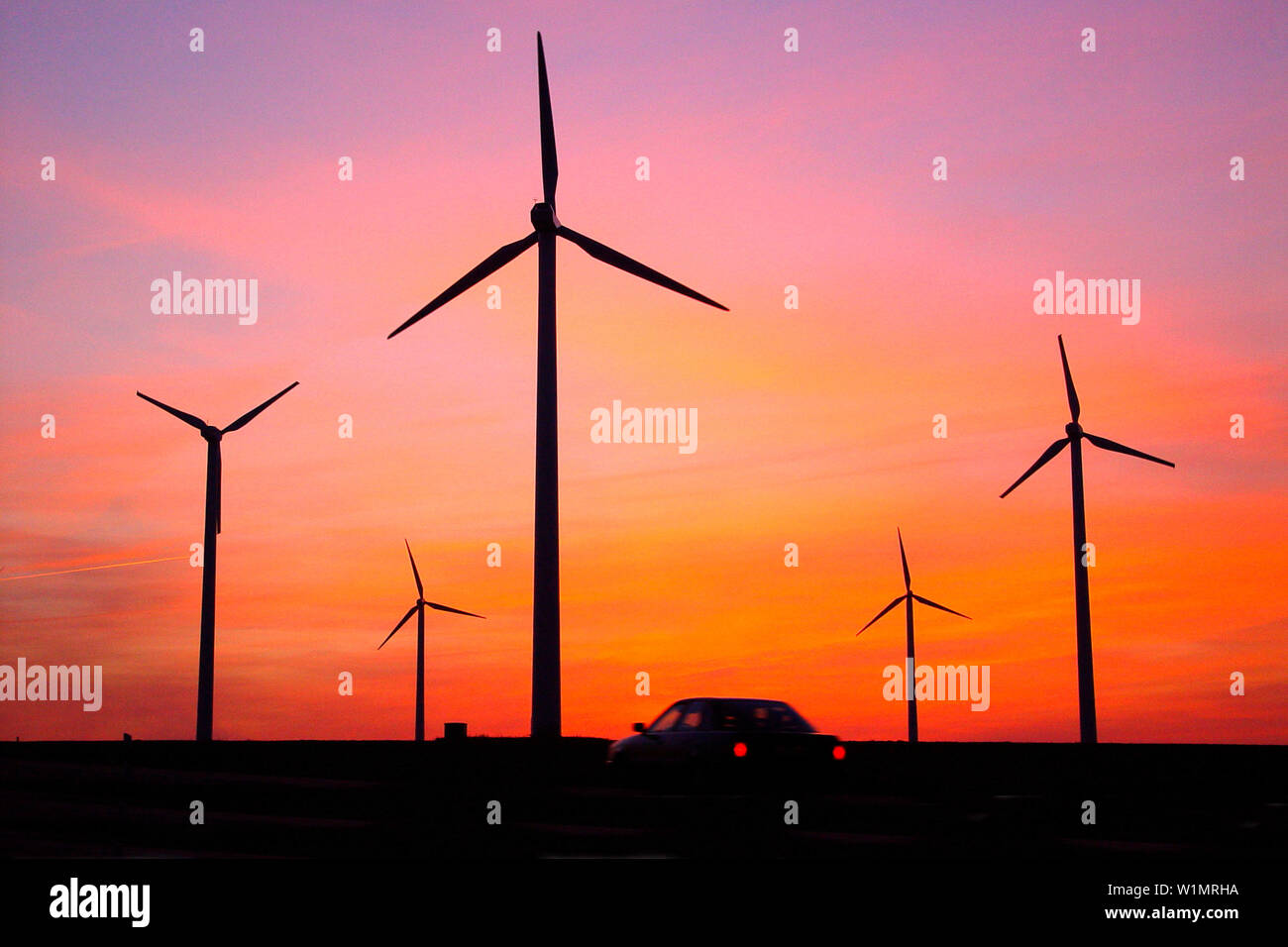 Car in front of a wind park, Wittstock, Mecklenburg-Western Pomerania, Germany Stock Photo