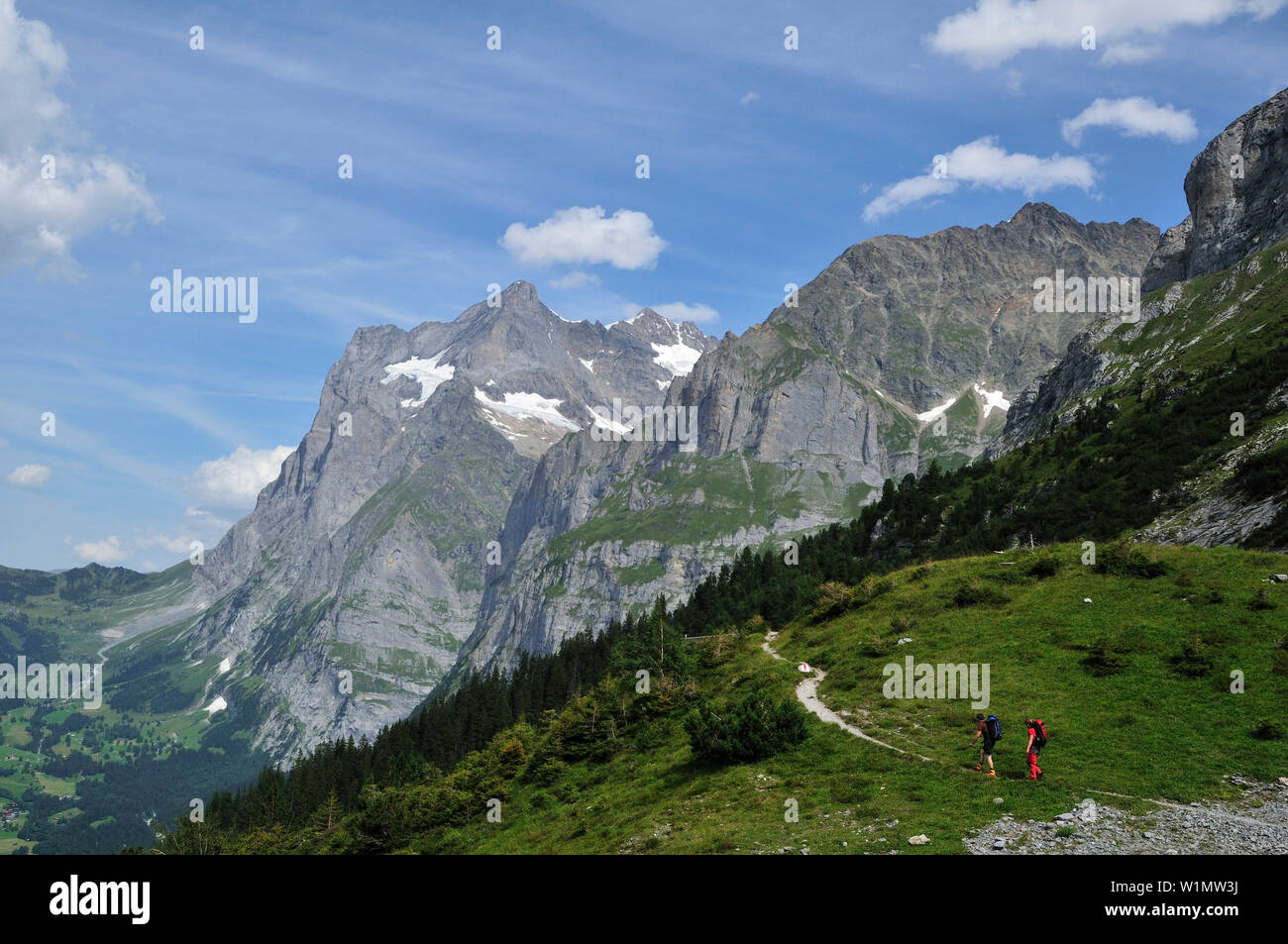 Two mountaineers on the way uo to Ostegghuette, Bernese Alps, Switzerland Stock Photo
