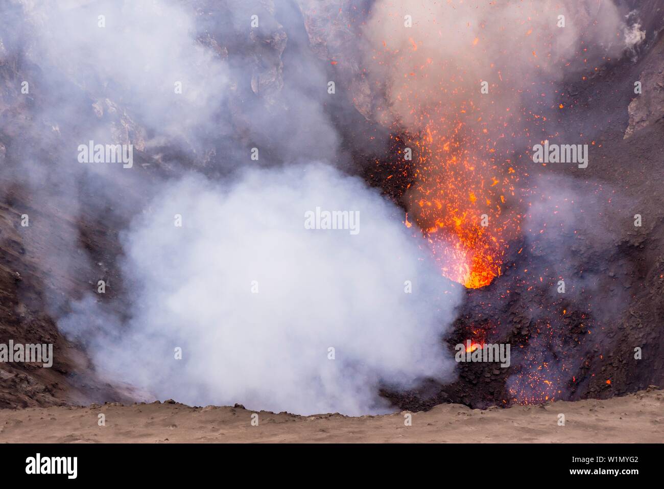 Look inside the active volcano Yasur during a lava eruption. Lava and