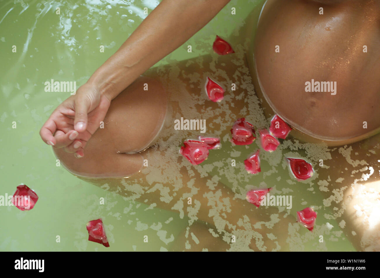 Pregnant woman takes a bath. Stock Photo by ©stasia04 253403156