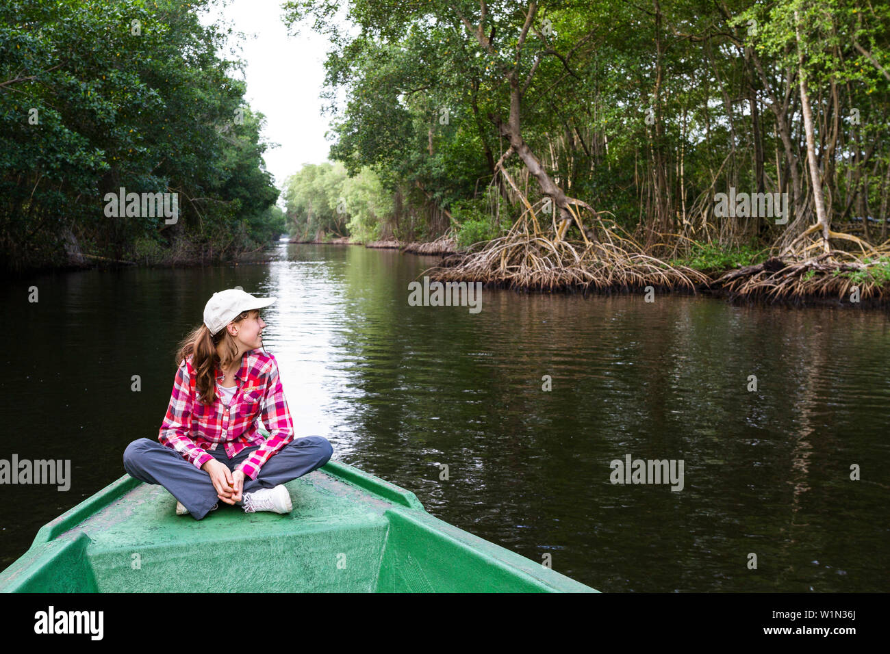 13 year old girl on a boat trip in the Mangroves, Caroni Swamps, Trinidad, West Indies, Caribbean, South America Stock Photo