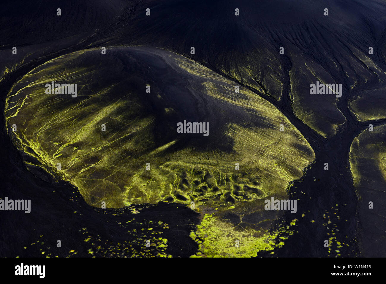 Aerial view of volcanic dark mountains covered with fluorescent mosses, Veidivotn, Highlands, South Iceland, Iceland, Europe Stock Photo