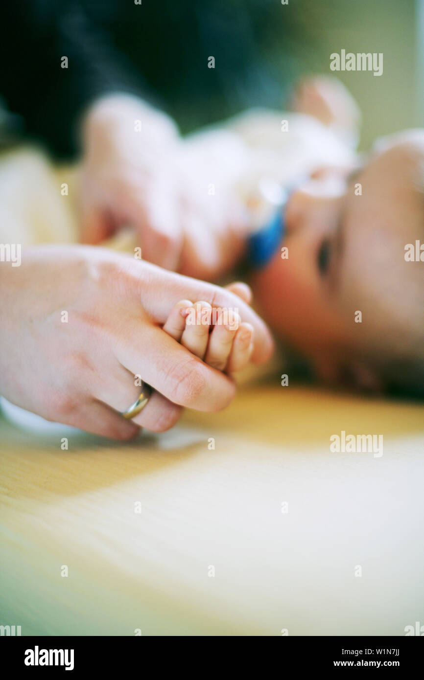 Baby playing with teddy bear Stock Photo - Alamy