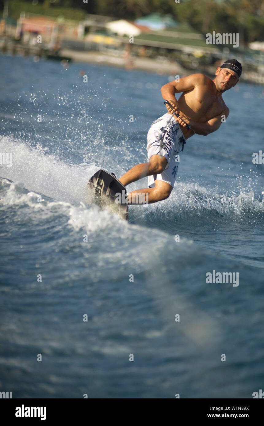 Man waterskiing, sports man waveboarding Stock Photo - Alamy