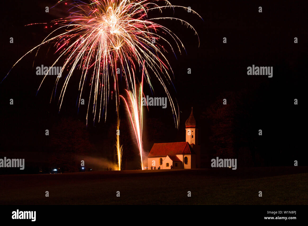 Fireworks over Hub-chapel at New Year's Eve, Penzberg, Upper Bavaria, Germany, Europe Stock Photo