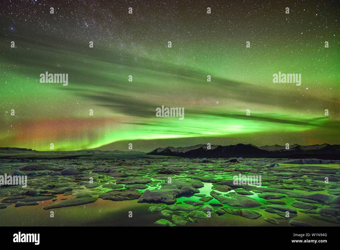 Multicolored Northern Lights Aurora Borealis Over Glacial