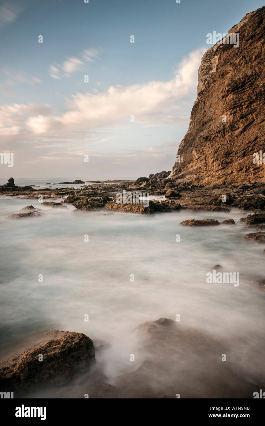 rough sea hitting the coast of rocky bay Playa de Alojera, La Gomera, Canary Islands, Spain, long time exposure Stock Photo