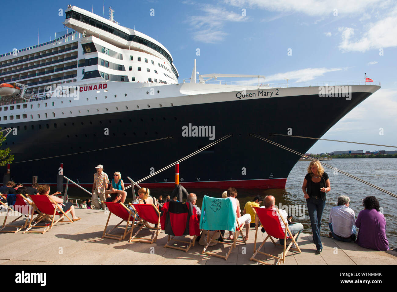 People Sitting On Deck Chairs At Chicagokai In Front Of The Cruise people-sitting-on-deck-chairs-at-chicagokai-in-front-of-the-cruise