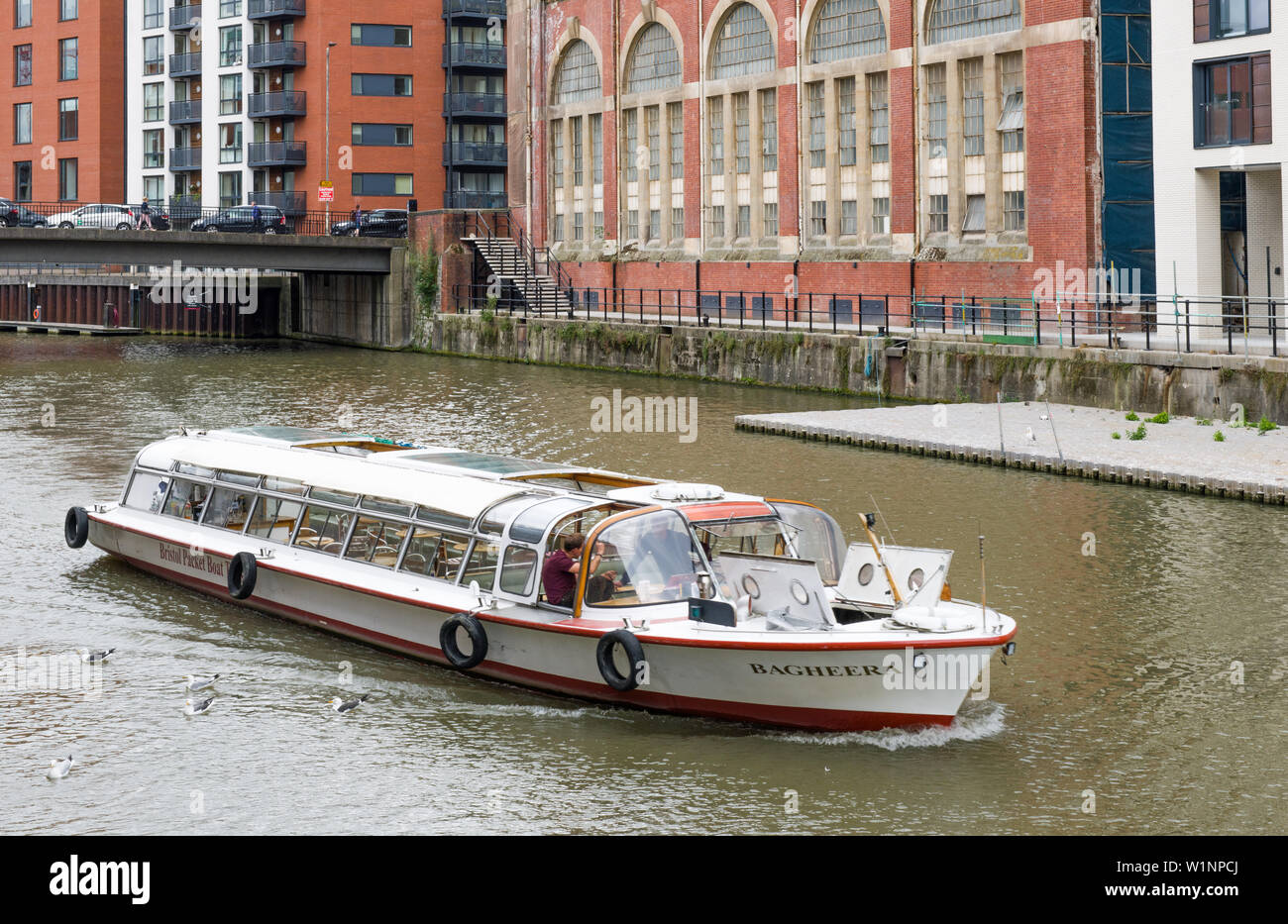 The Bagheera, cabin boat Cruising towards the Floating Harbour in Bristol down the Feeder Canal Stock Photo