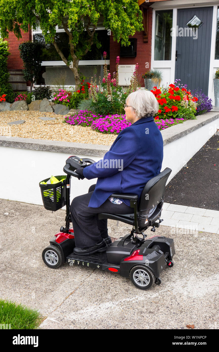 Electric disabled scooter hires stock photography and images Alamy