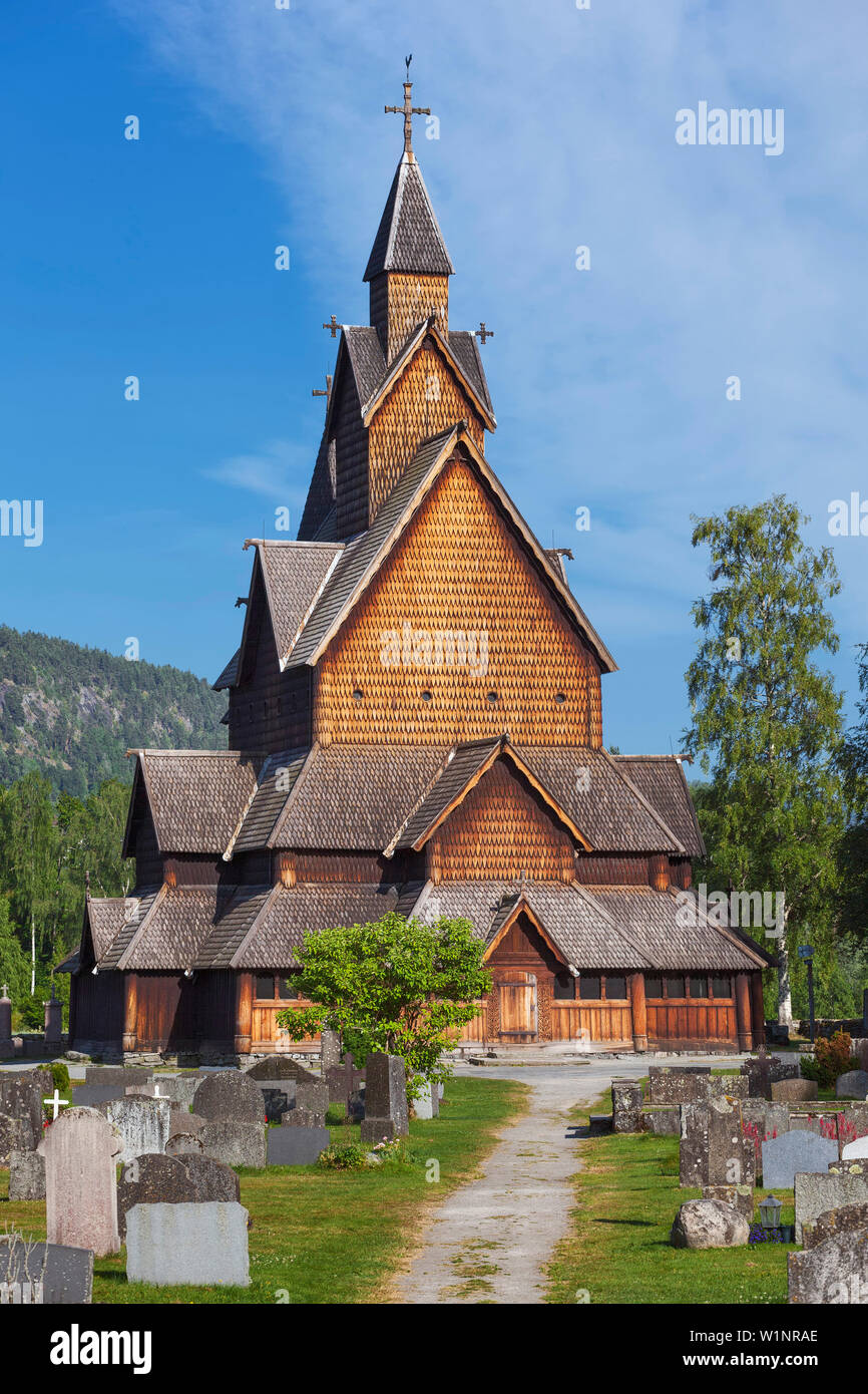 Heddal stave church with path and grave stones in summer, Notodden ...