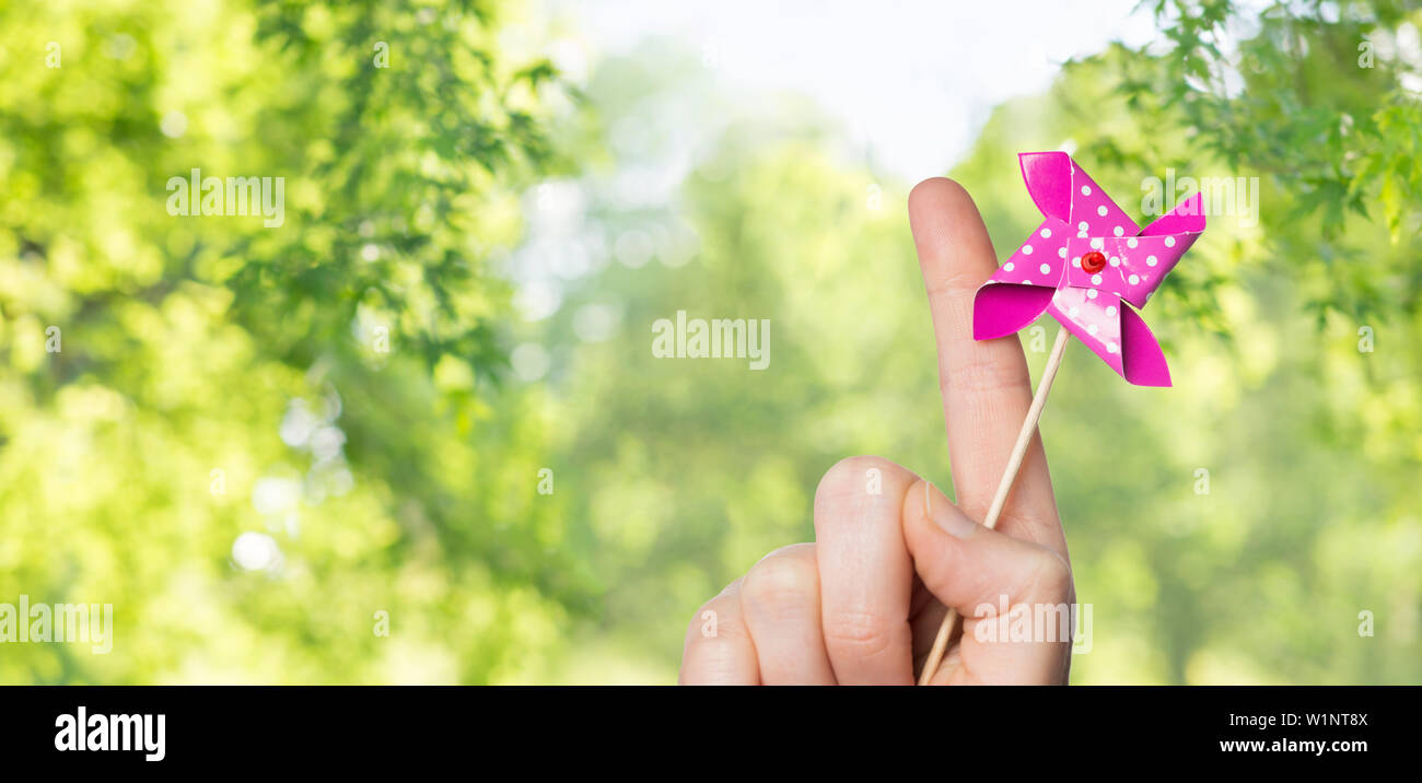 Pinwheel Hand Hand holding pin hi-res stock photography and images - Alamy