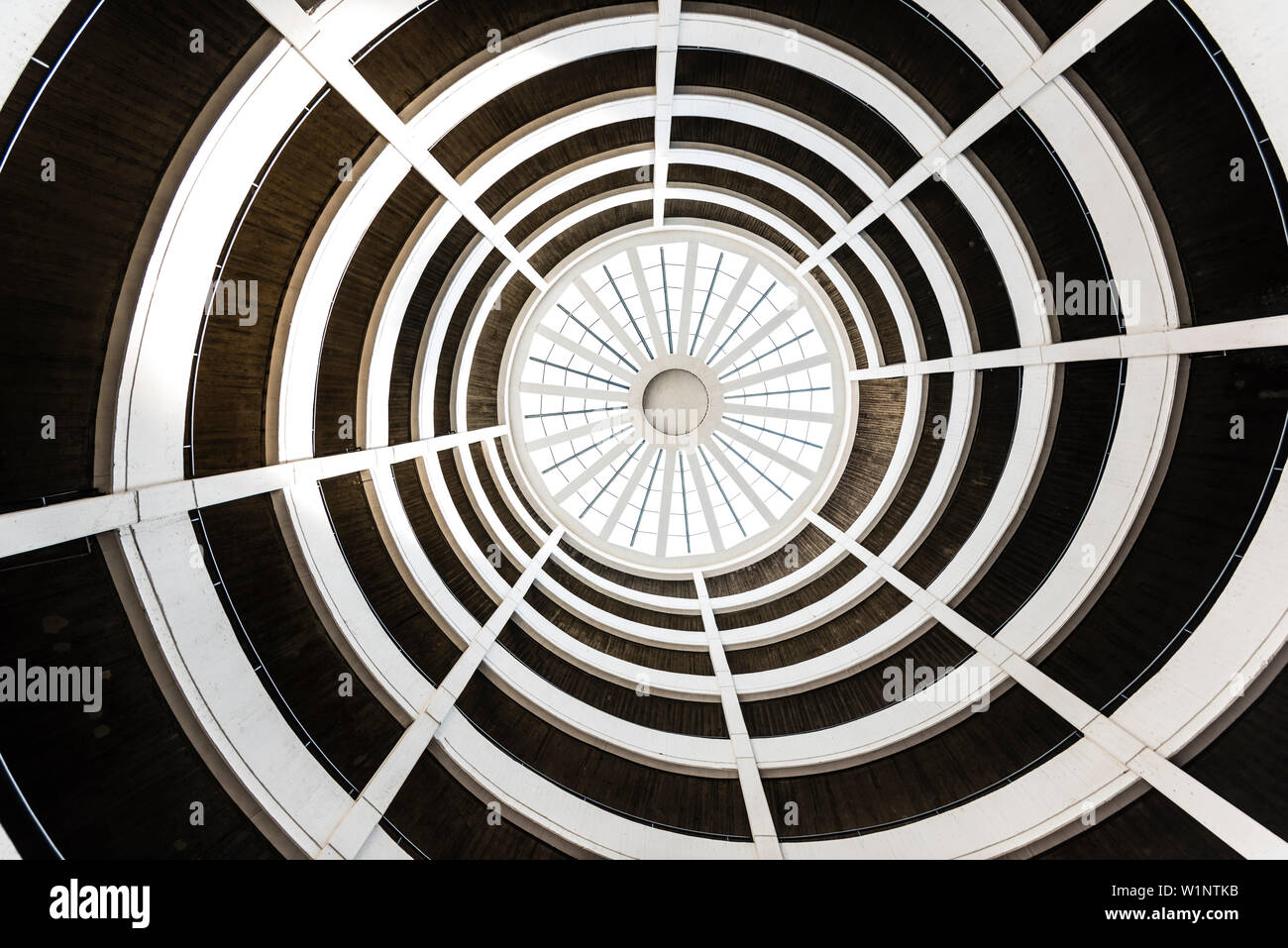 The graphically looking spiral driveway to a multi-storey car park from a low angle view, Hamburg, Germany Stock Photo