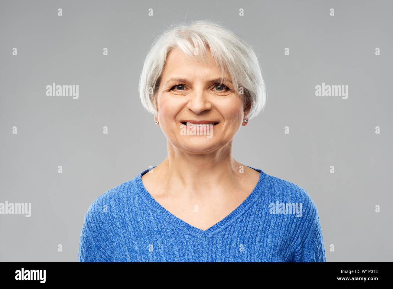 Senior woman in blue hi-res stock photography and images - Alamy