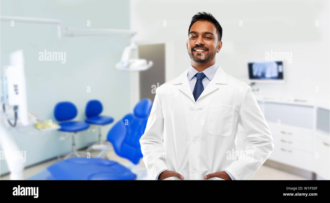indian male dentist in white coat at dental clinic Stock Photo Alamy