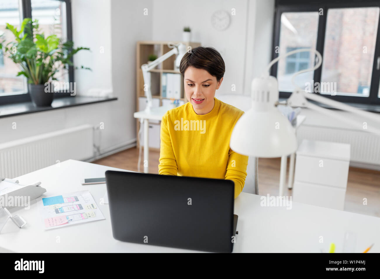 creative woman working on user interface at office Stock Photo