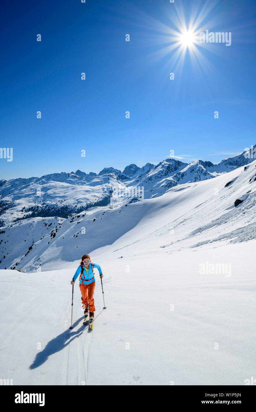 Woman backcountry-skiing ascending towards Soemen, Soemen, Sellrain, Stubai Alps, Tyrol, Austria Stock Photo