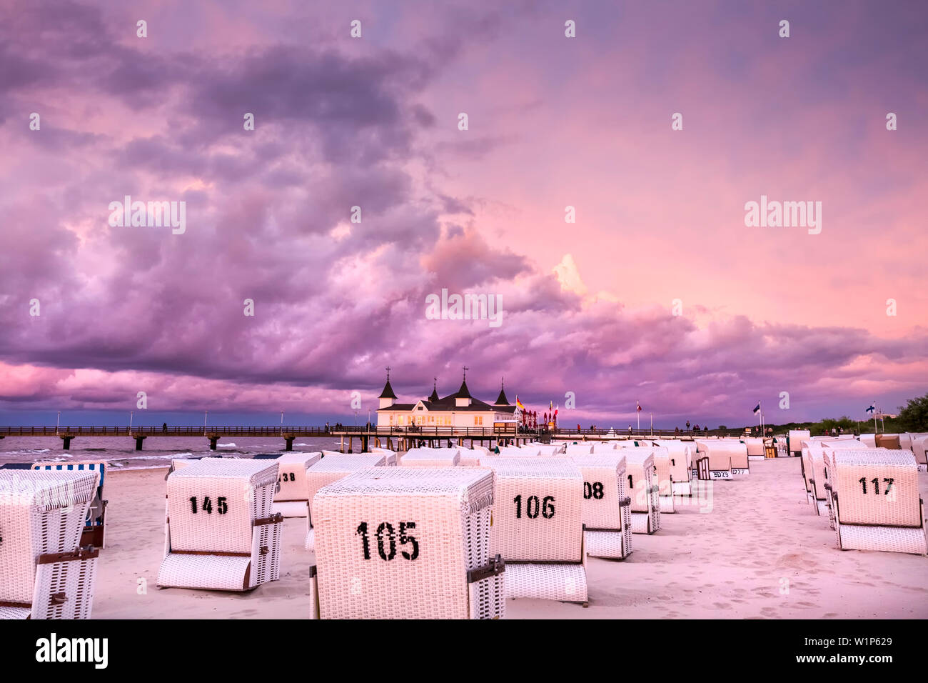 Beach chairs and pier at sundown, Ahlbeck, Usedom island, Mecklenburg