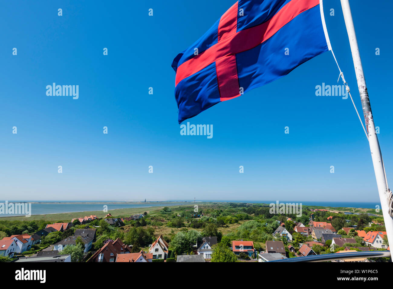 View from the old lighthouse with flag Oldenburger Land, Wangerooge, East Frisia, Lower Saxony, Germany Stock Photo