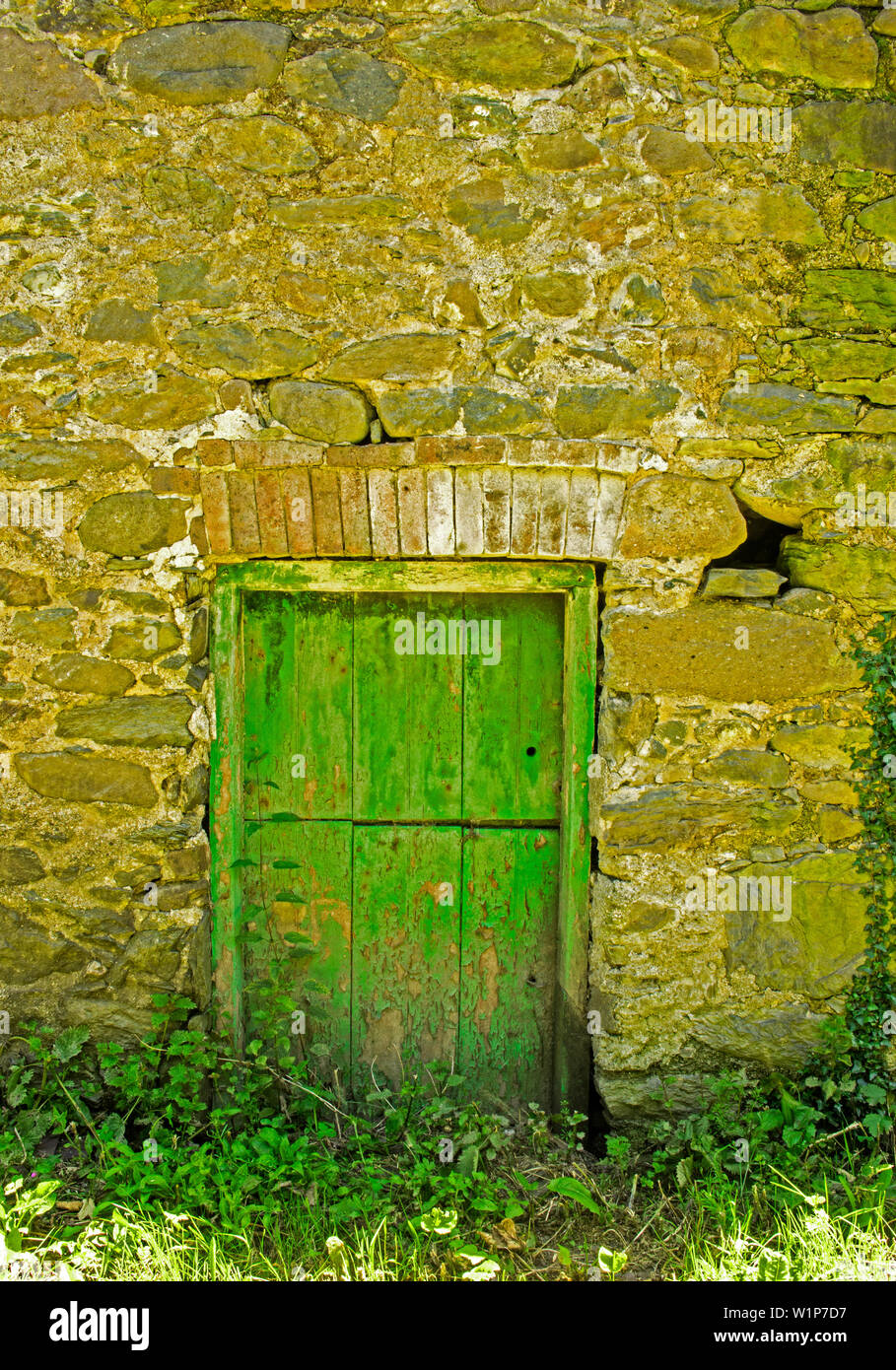 An old door in a stone barn Stock Photo