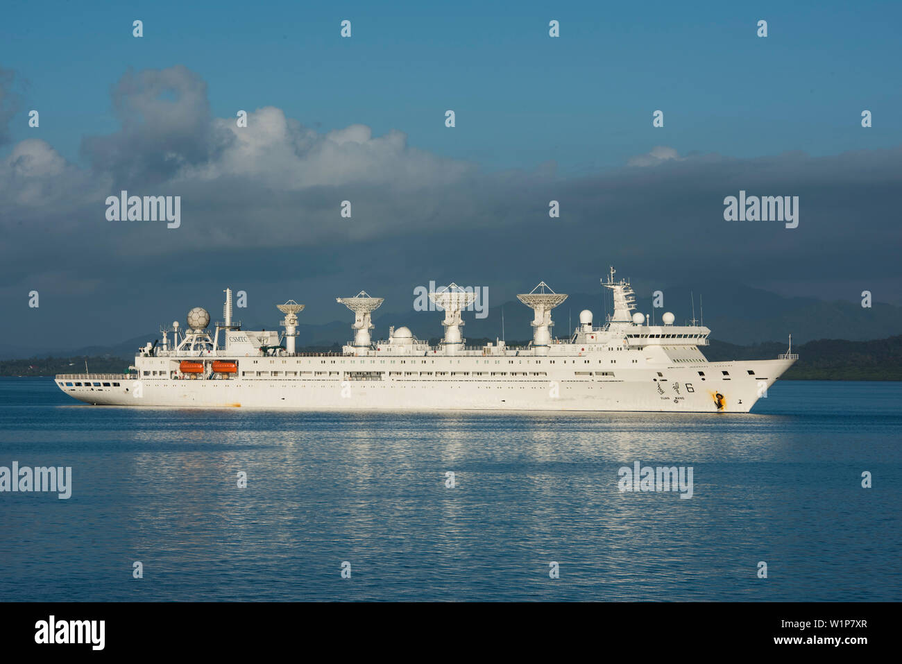 A Chinese Satellite and Marine Tracking Control (CSMTC) ship with four large tracking dishes lies at anchor in the harbor, Suva, Vanua Levu, Fiji, Sou Stock Photo