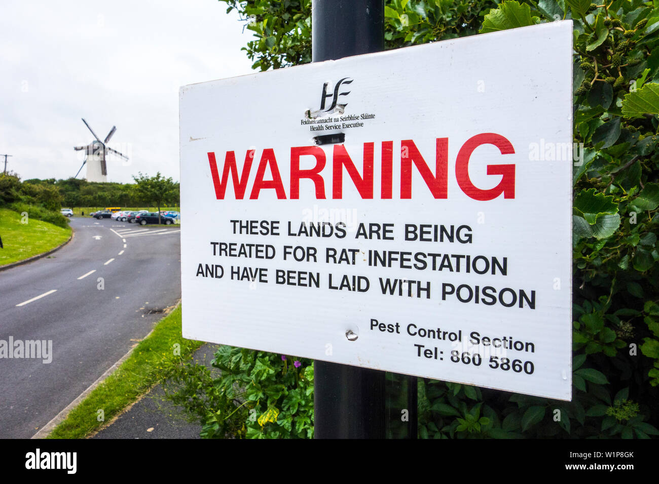 A warning notice in a public park In Skerries, Dublin, Ireland notifying that the land has been laid with poison for rat infestation Stock Photo