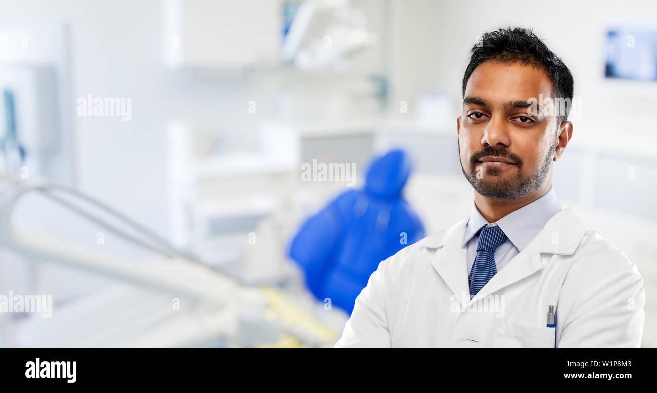 indian dentist in white coat at dental clinic Stock Photo Alamy