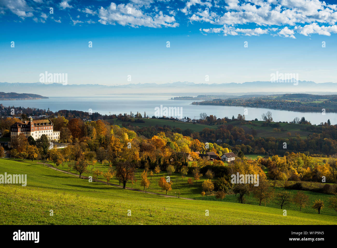 View of Spetzgart Castle over Lake Constance to the Alps in autumn, Überlingen, Baden-Württemberg, Germany Stock Photo
