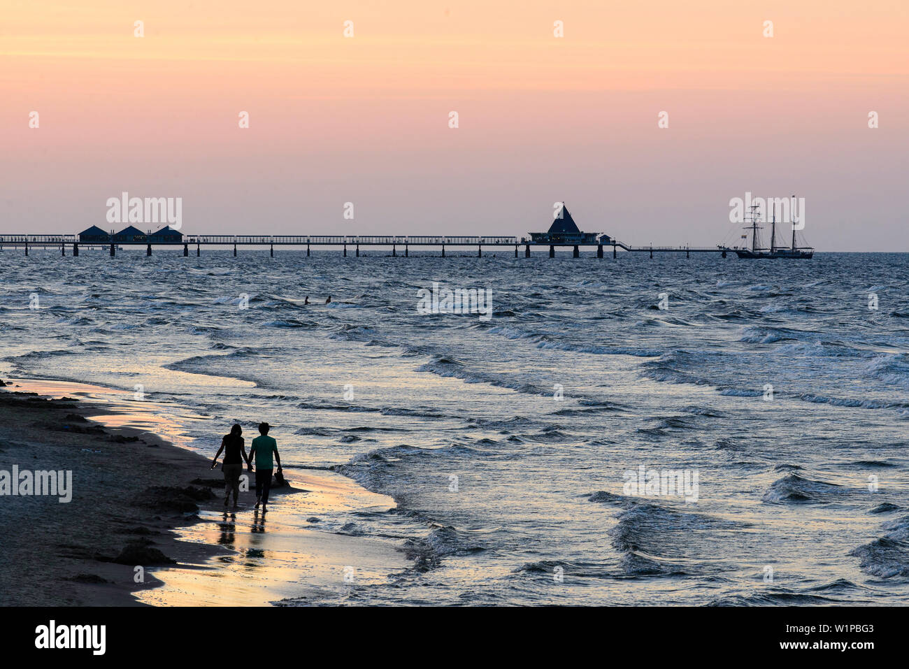 People are walking on the beach. View from the Ahlbecker beach on the sea bridge of Heringsdorf, Ahlbeck, Usedom, Baltic Sea coast, Mecklenburg-Wester Stock Photo