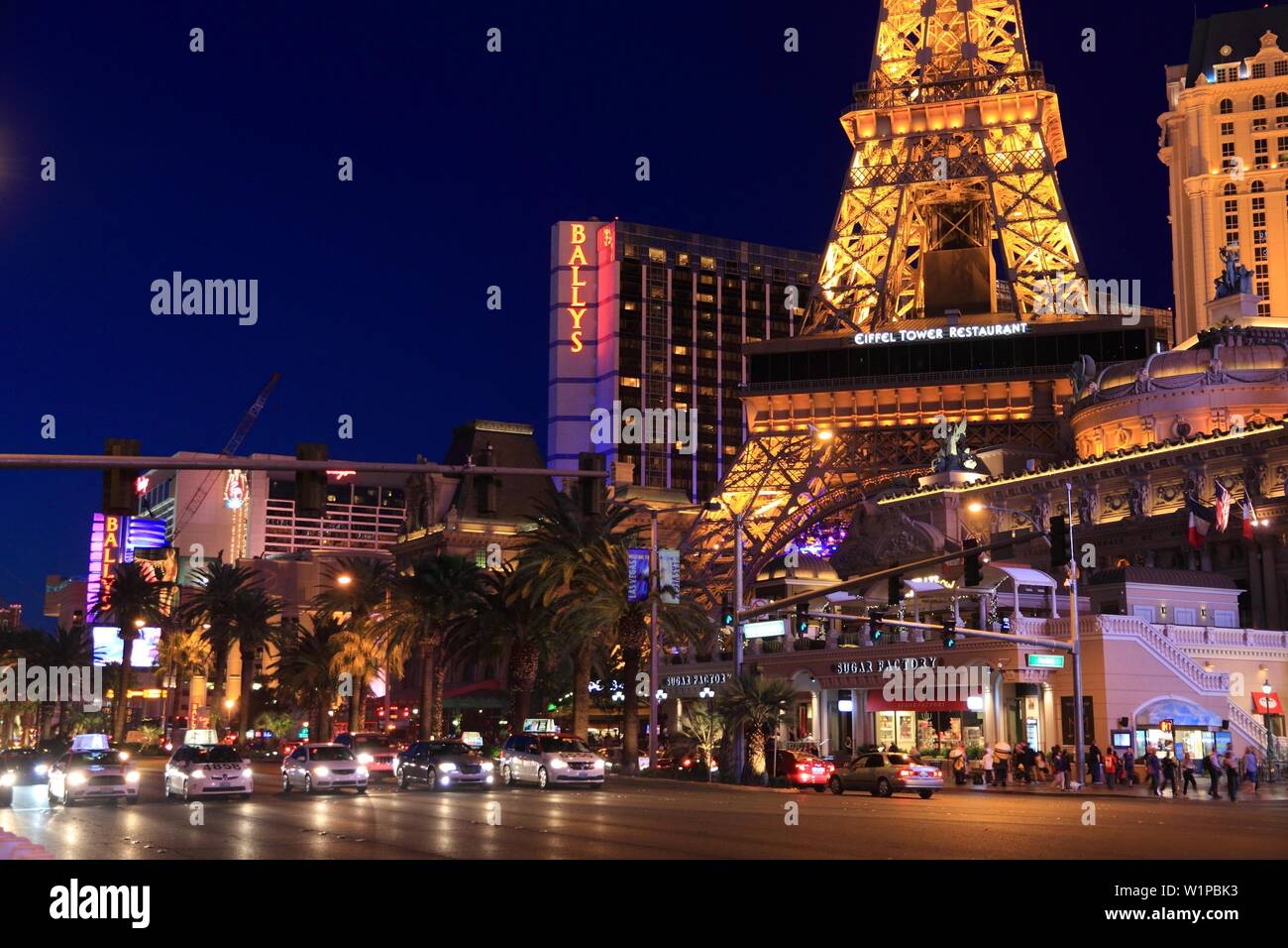 LAS VEGAS, USA - APRIL 14, 2014: People visit the famous Strip in Las Vegas. 15 of 25 largest hotels in the world are located at the strip with more t Stock Photo