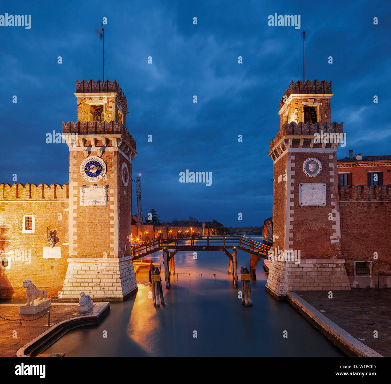 Arsenale di Venezia, the former shipyard and naval base in the blue of the night, with an illuminated wall Ingresso All'Acqua, Venetian Arsenal, Caste Stock Photo