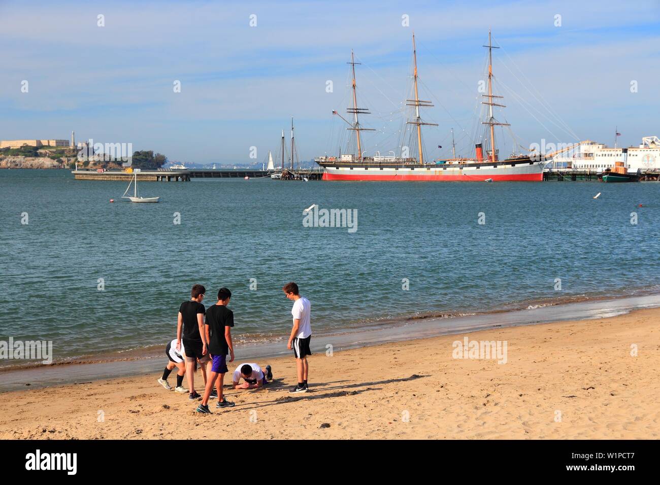 SAN FRANCISCO, USA - APRIL 8, 2014: People visit Aquatic Park beach in San Francisco, USA. San Francisco is the 4th most populous city in California ( Stock Photo