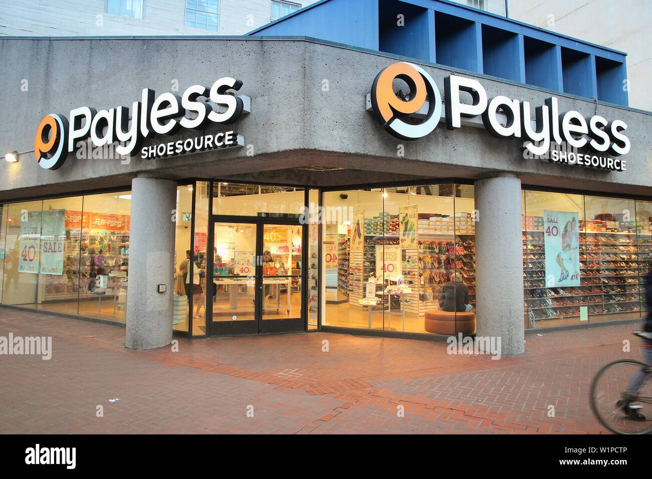 SAN FRANCISCO, USA - APRIL 8, 2014: Shoppers visit Payless Shoesource footwear store in San Francisco, USA. Payless went bankrupt in 2017. Stock Photo