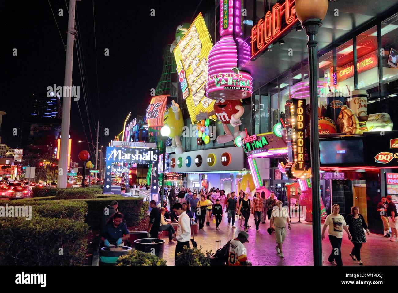 LAS VEGAS, USA - APRIL 13, 2014: People visit the famous Strip in Las Vegas. 15 of 25 largest hotels in the world are located at the strip with more t Stock Photo