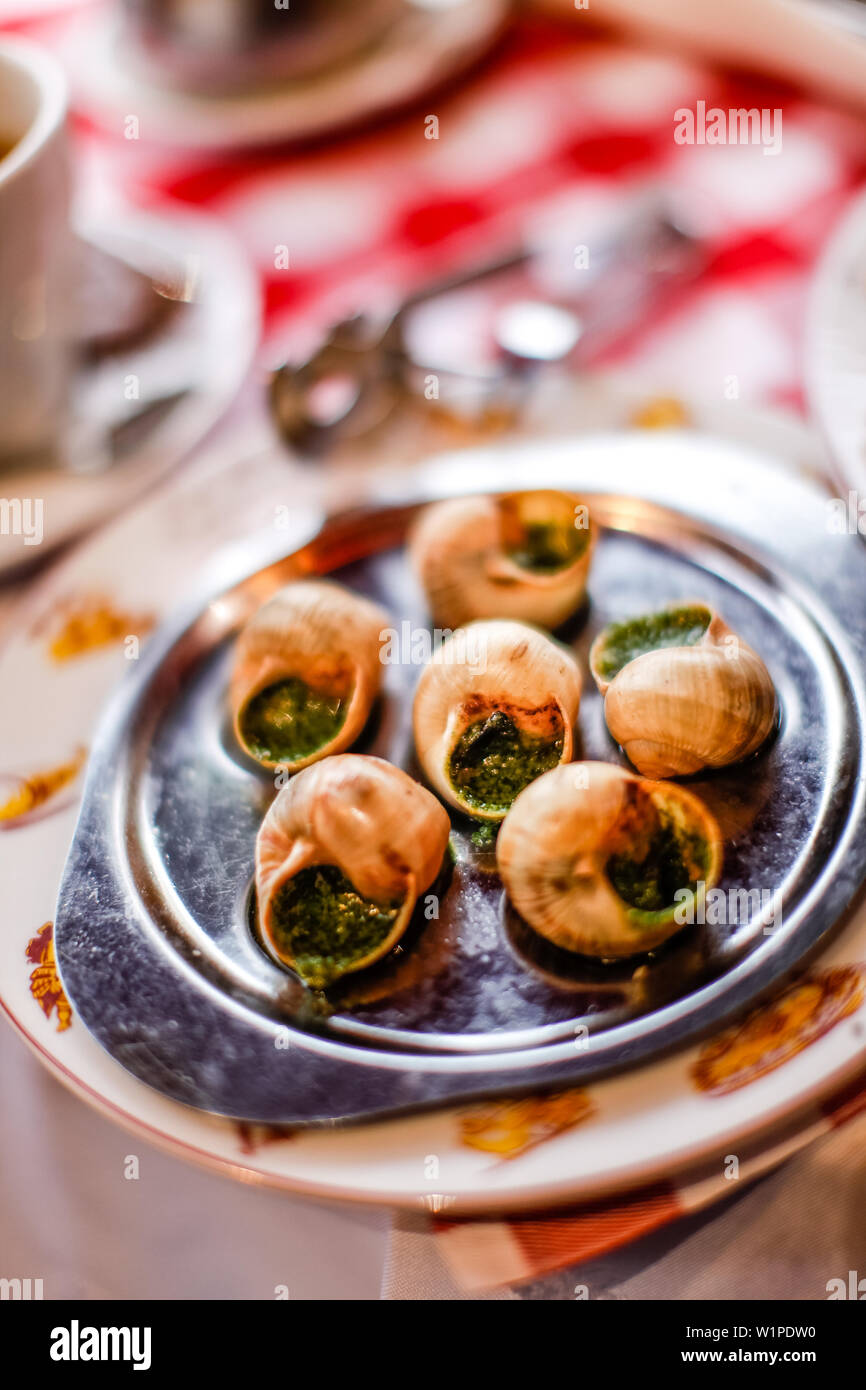 Escargots (snails) served on the table in La Mère Catherine restaurant