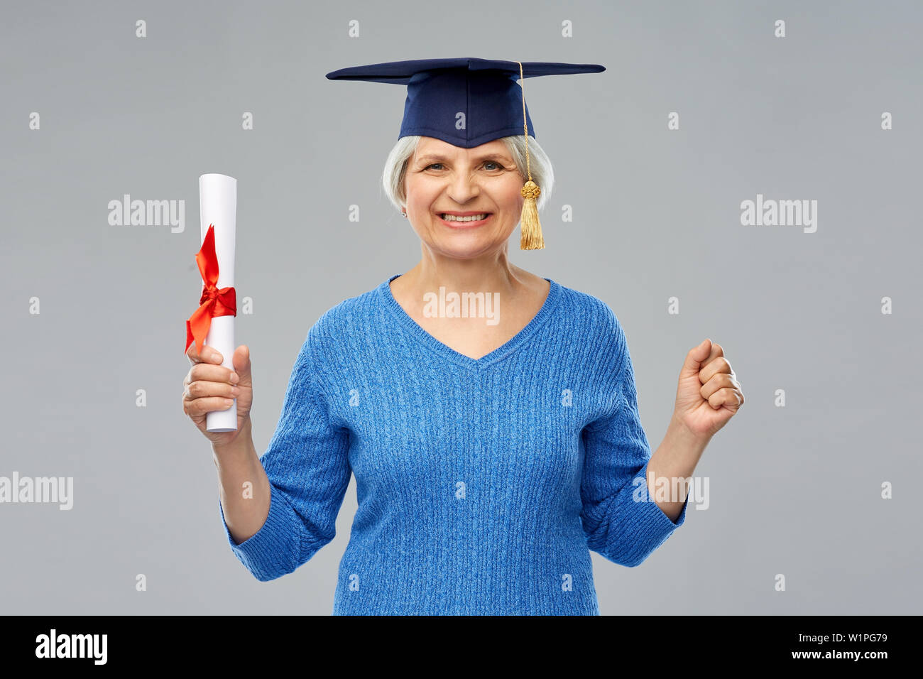 happy senior graduate student woman with diploma Stock Photo