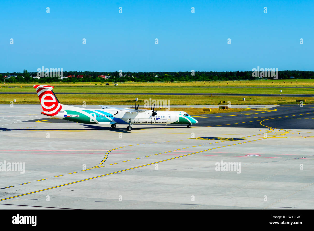 Poznan, Poland - June 18, 2019: LOT plane - Bombardier Dash 8-Q402 - seen through the window of Lawica Airport in Poznan Stock Photo