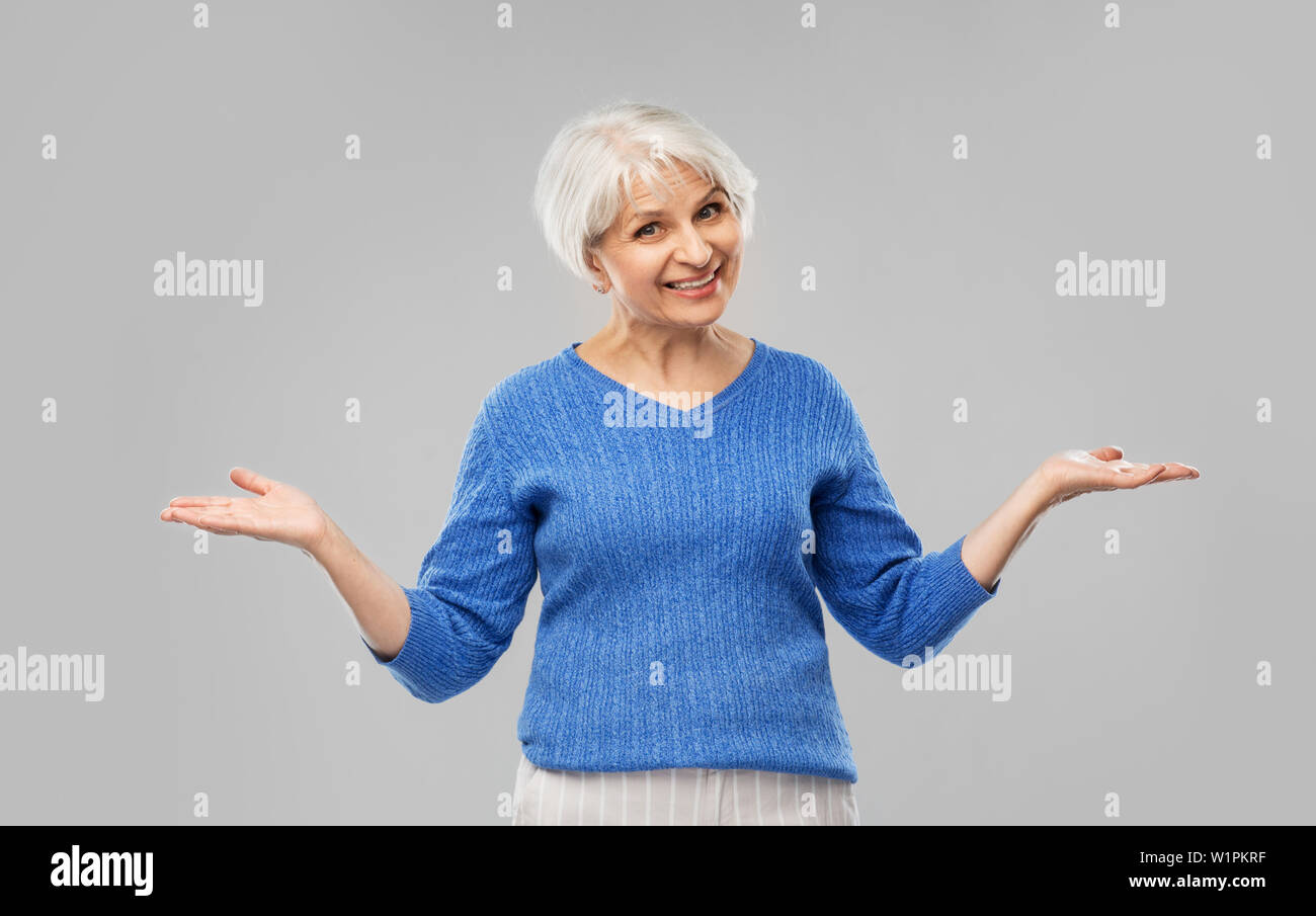 Lady presenting hand blue hi-res stock photography and images - Alamy