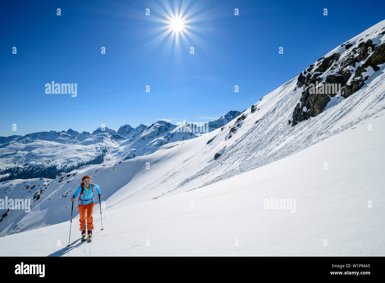 Woman backcountry-skiing ascending towards Soemen, Soemen, Sellrain, Stubai Alps, Tyrol, Austria Stock Photo