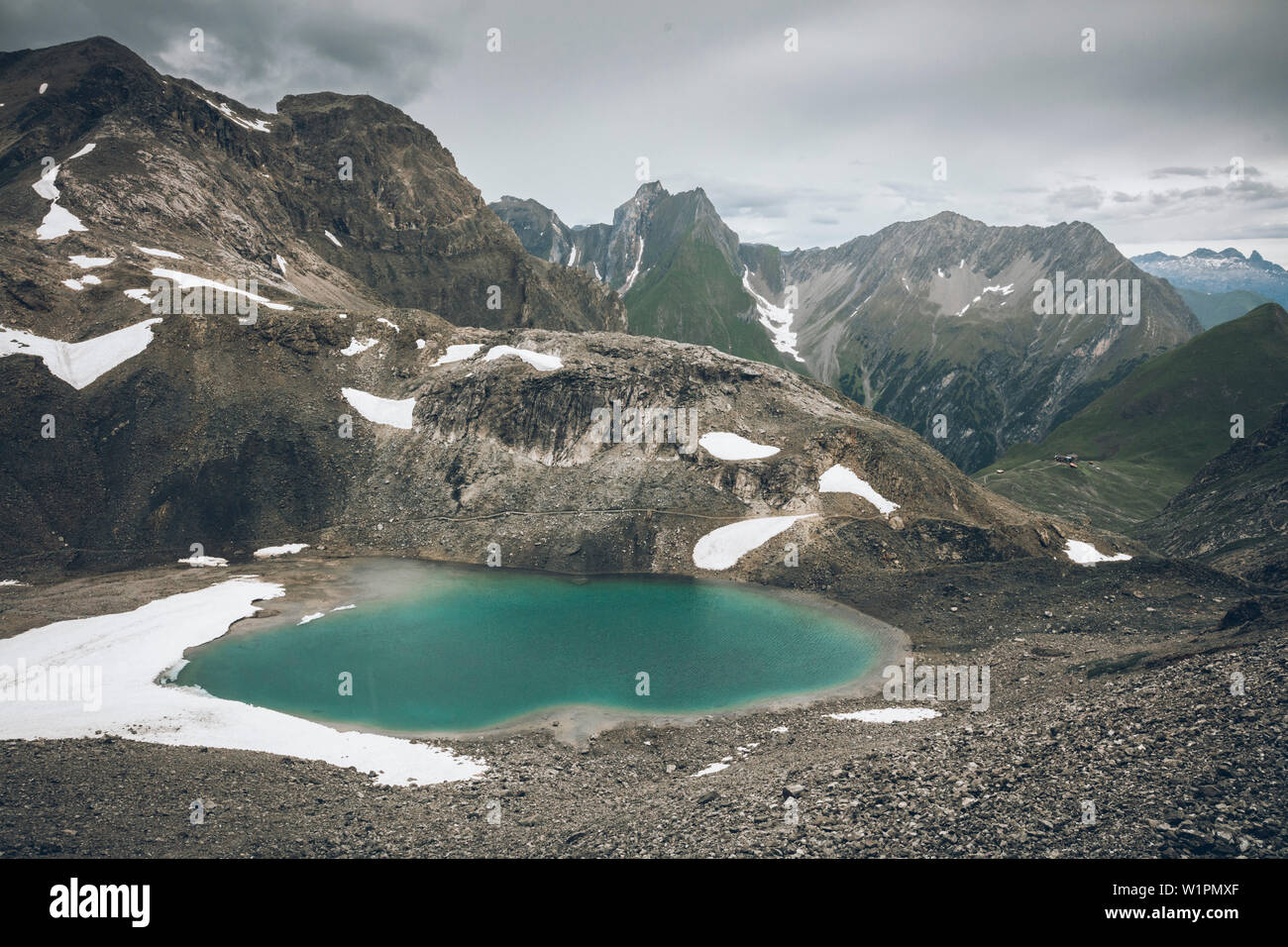 Mountain lake at the Seescharte, E5, Alpenüberquerung, 3rd stage, Seescharte,Inntal, Memminger Hütte to Unterloch Alm, tyrol, austria, Alps Stock Photo