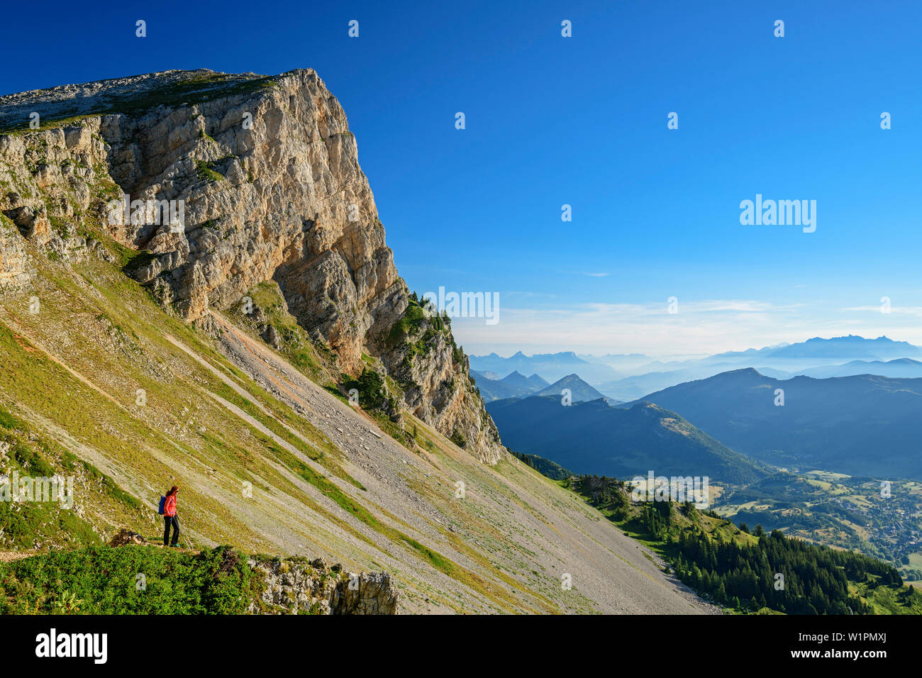 Woman while hiking Enjoy the views, from the Grand Veymont, Vercors, Dauphine, Dauphine, Isère, France Stock Photo