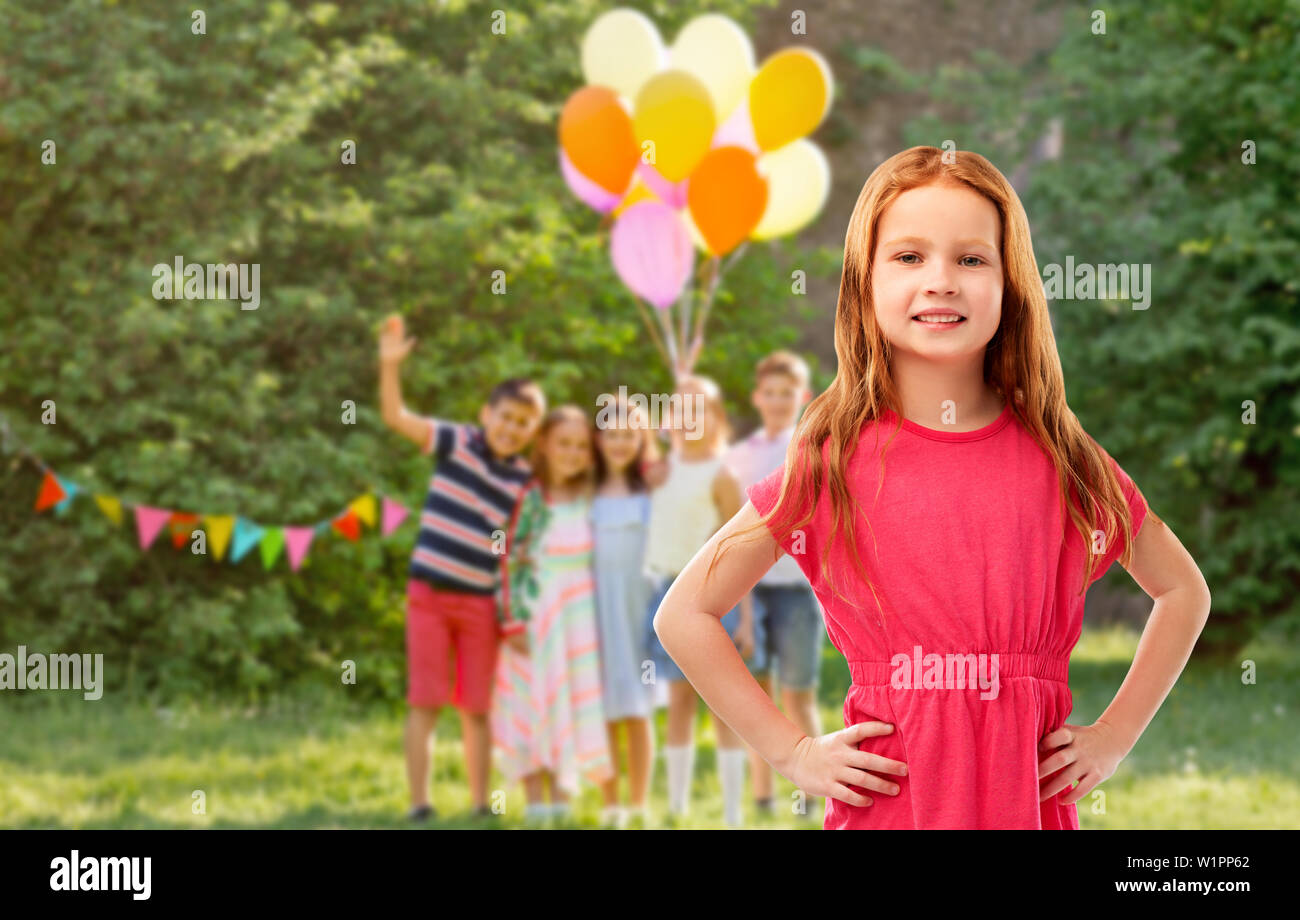 smiling red haired girl at birthday party Stock Photo