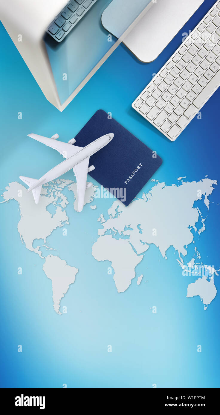 booking and search flight ticket air international travel concept, computer,passport and airplane isolated on blue background with global map Stock Photo