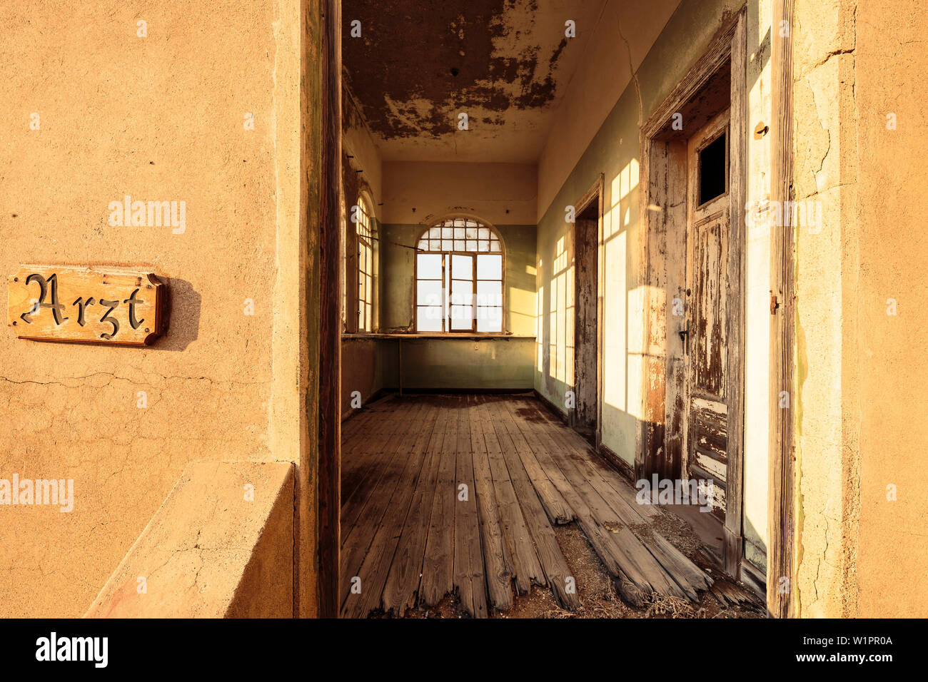 The morning sun in the doctor's house of the ghost town in Kolmanskop, former mining town, Karas, Namibia. Stock Photo