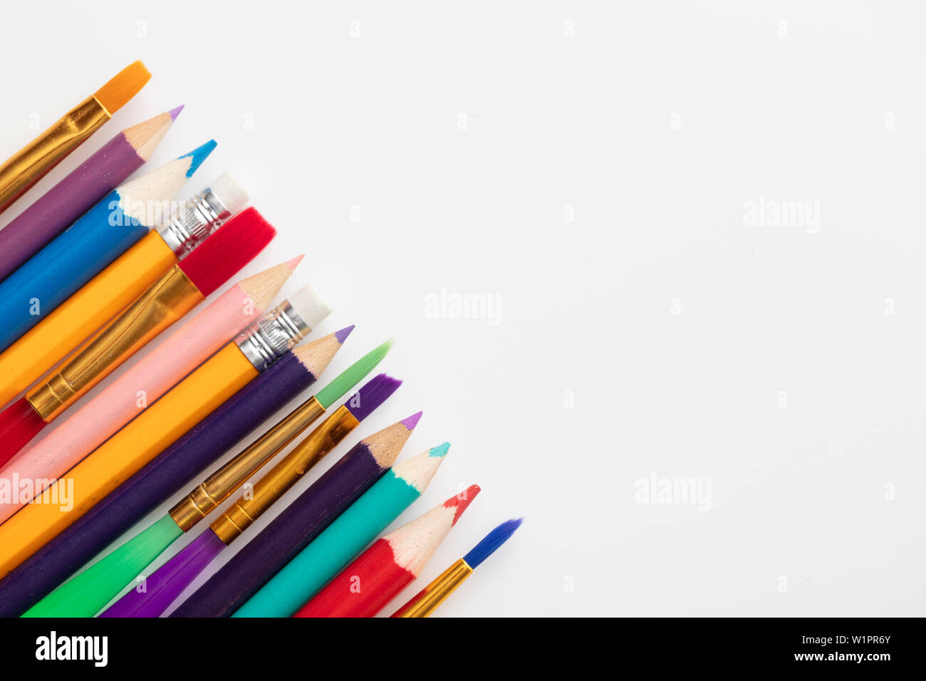 Row of school art and craft supplies on a white background Stock Photo -  Alamy