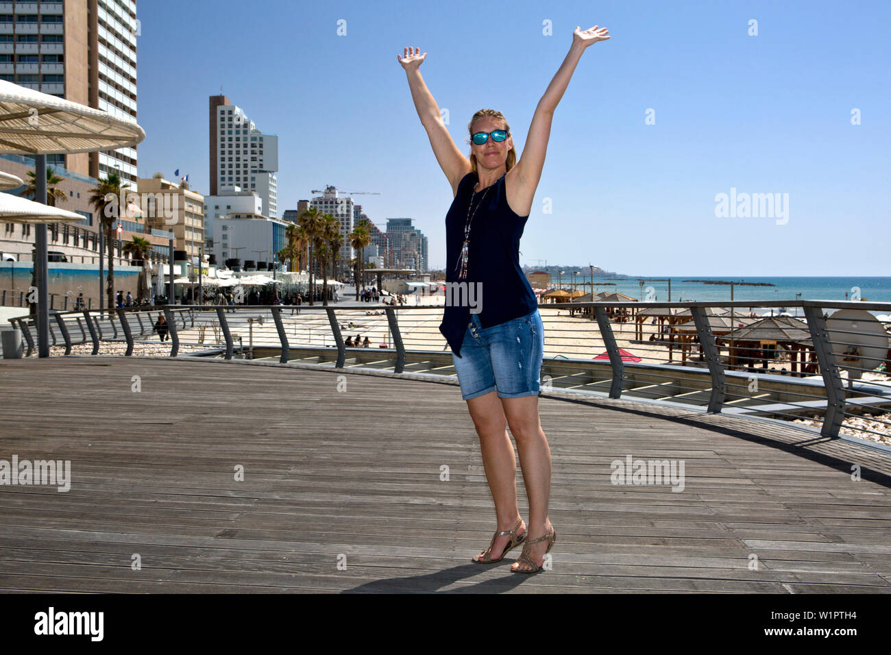 Woman on the Tayelet (beach promenade), Tel-Aviv, Israel Stock Photo