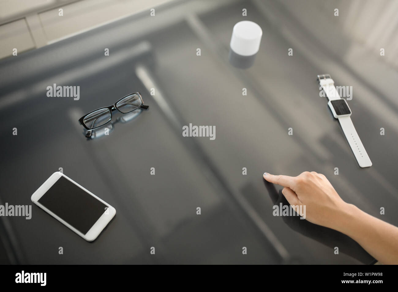close up of hand using black interactive panel Stock Photo
