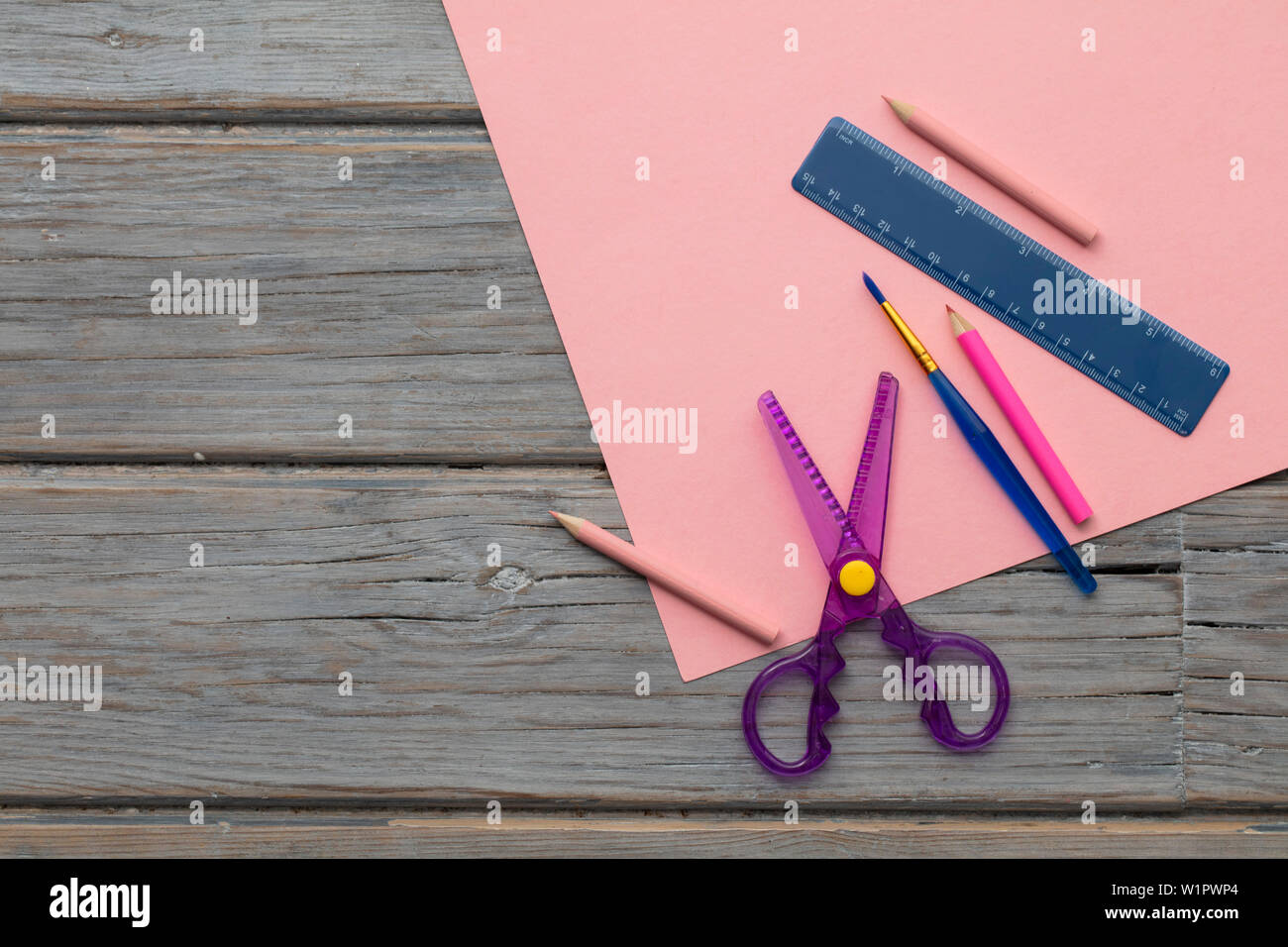 Creative Hobby Art Supplies On Pink Paper Overhead Desk