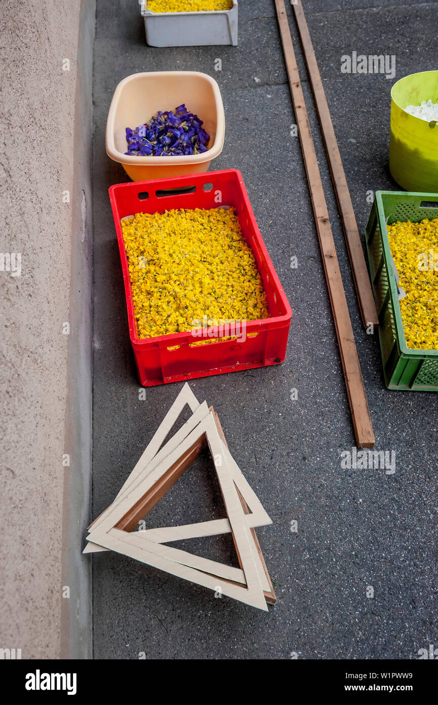 People arranging petals for the flower carpet, Corpus Christi, Feast of